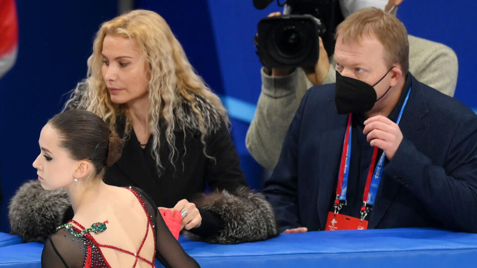 BEIJING, CHINA - FEBRUARY 17: Kamila Valieva of Team ROC talks to coaches Eteri Tutberidze (L) and Sergei Dudakov (R) during the Women Single Skating Free Skating on day thirteen of the Beijing 2022 Winter Olympic Games at Capital Indoor Stadium on February 17, 2022 in Beijing, China. (Photo by David Ramos/Getty Images)