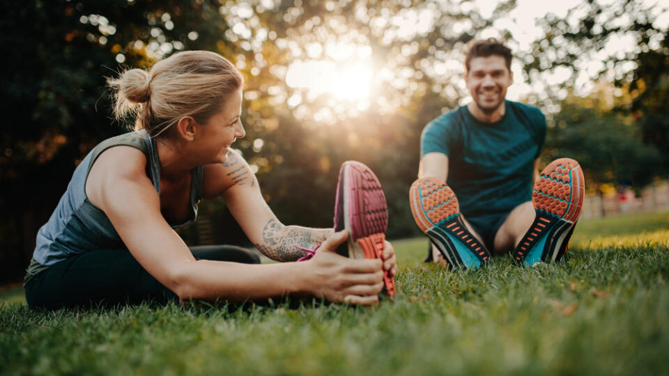 Fitness,Couple,Stretching,Outdoors,In,Park.,Young,Man,And,Woman