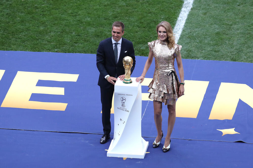 MOSCOW, RUSSIA - JULY 15: Former German International Footballer, Philipp Lahm and Philanthropist, Natalia Vodianova present the 2018 FIFA World Cup Original Trophy ahead of the 2018 FIFA World Cup Final between France and Croatia at Luzhniki Stadium on July 15, 2018 in Moscow, Russia. (Photo by Catherine Ivill/Getty Images)