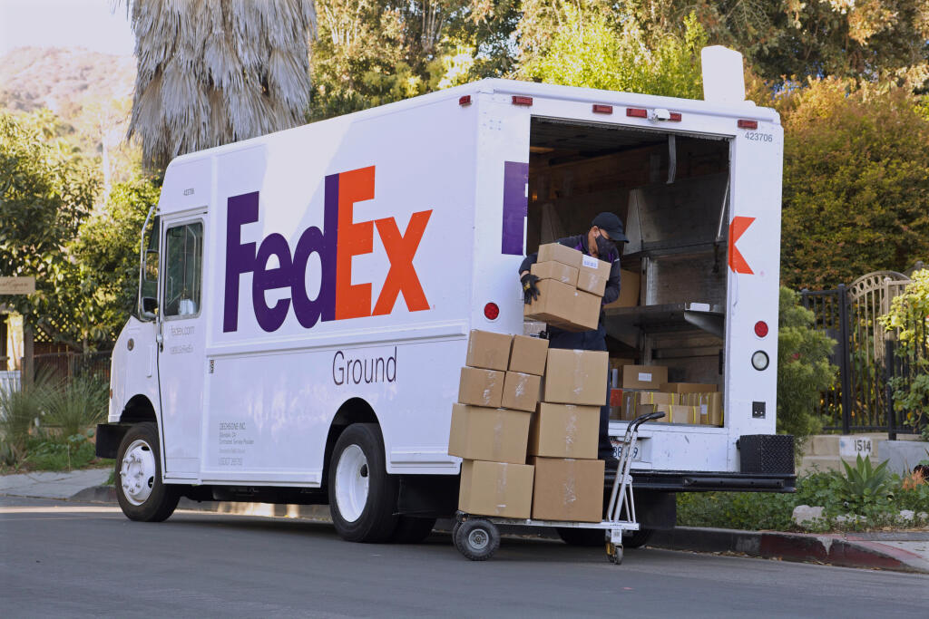 Los,Angeles,-,February,26,,2021:,Fedex,Driver,Loading,Boxes