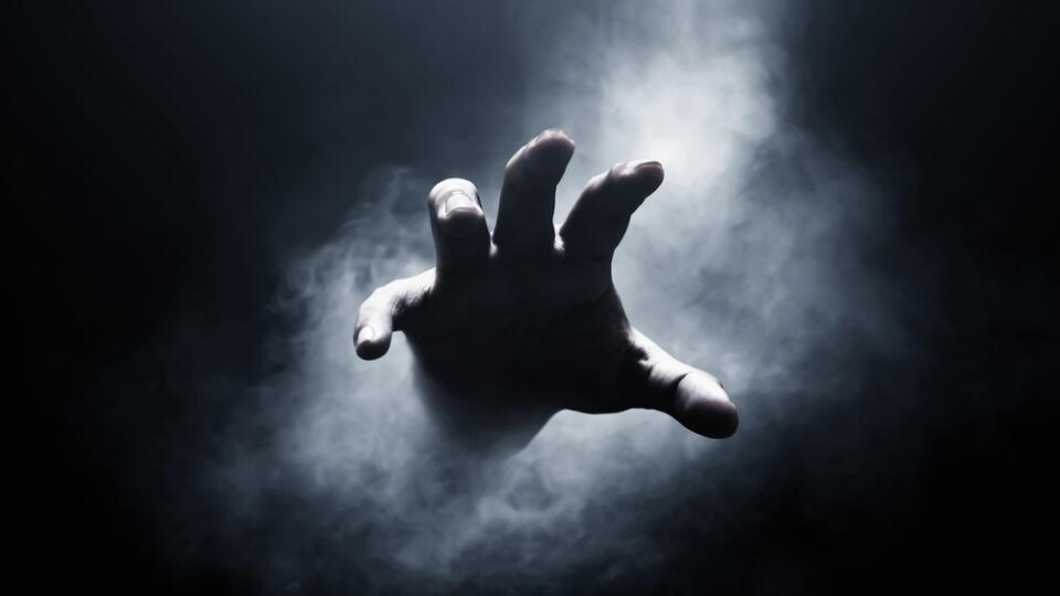 Human,Hand,On,Dark,Background