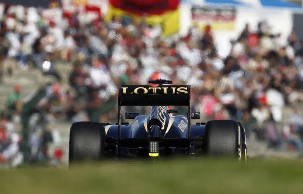 Lotus driver Kimi Raikkonen of Finland steers his car during the qualifying session for the Japanese Formula One Grand Prix at the Suzuka circuit in Suzuka, Japan, Saturday, Oct. 12, 2013. (AP Photo/Greg Baker)