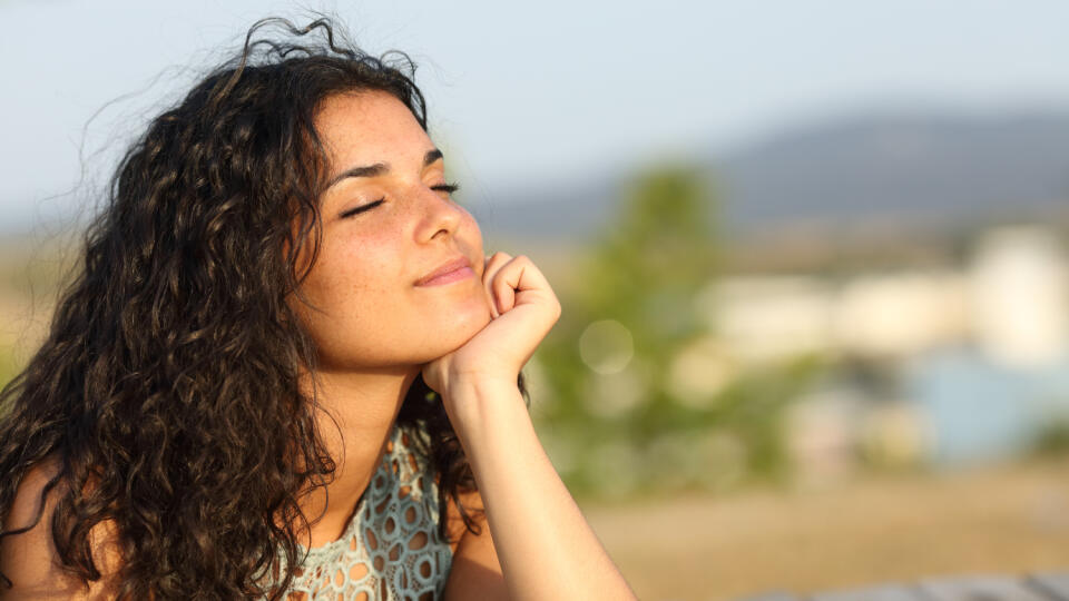 Woman,Relaxing,And,Enjoying,The,Sun,In,A,Warmth,Park