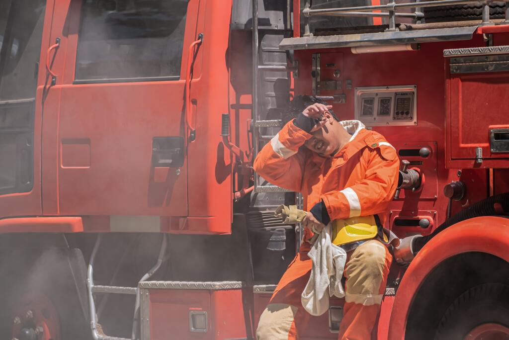 Sweat,Dripped,From,The,Firefighter's,Forehead,As,He,Sit,Leaned