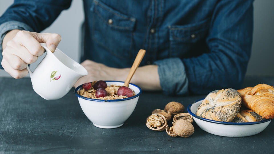 Young,Hipster,Man,Having,A,Breakfast,On,Dark,Table