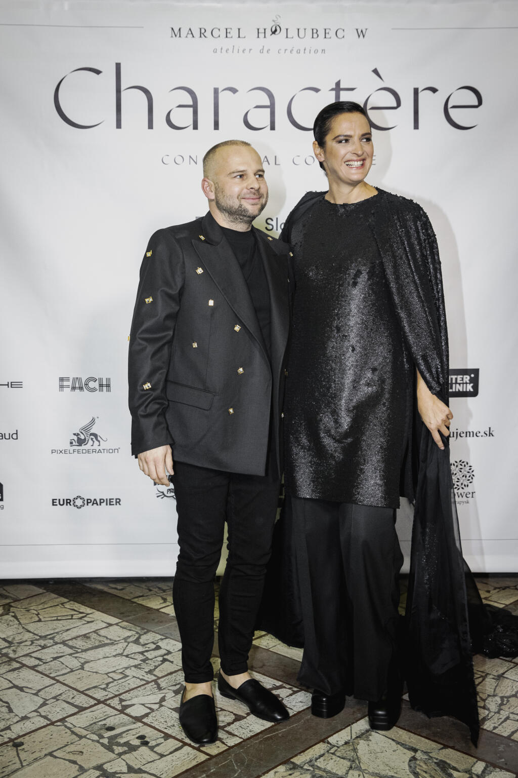 Na snímke Marcel Holubec a Jana Kirschner počas módnej prehliadky Marcela Holubca W s názvom MHW Charactere 2022.