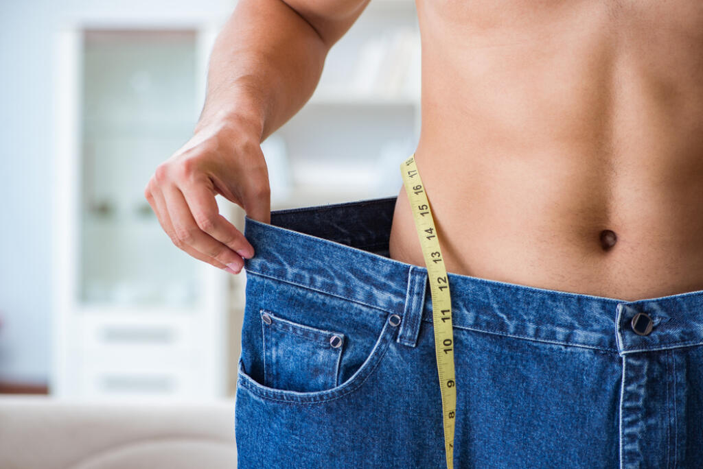 Man,In,Oversized,Pants,In,Weight,Loss,Concept