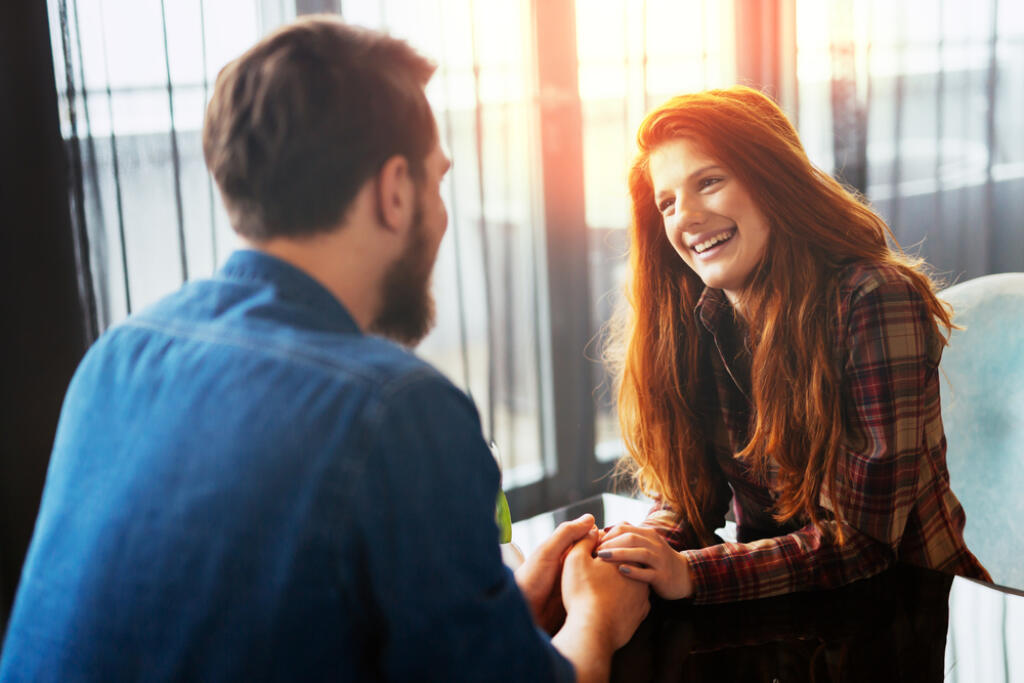 Happy,Woman,On,A,First,Date,With,Handsome,Man,Showing