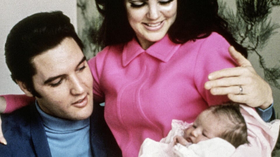 Elvis Presley and his wife, Priscilla, prepare to leave the hospital with their new daughter, Lisa Marie. Memphis, Tennessee, February 5, 1968.