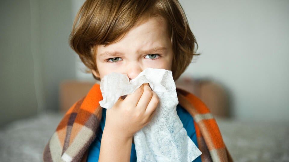 Cute,Little,Boy,Blowing,His,Nose,Into,A,Handkerchief.