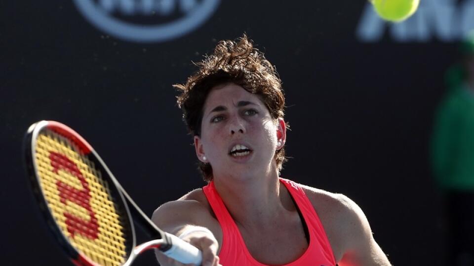 Spain's Carla Suarez Navarro returns a shot to Slovakia's Jana Cepelova during their first round match at the Australian Open tennis championships in Melbourne, Australia, Monday, Jan. 16, 2017. (AP Photo/Dita Alangkara )