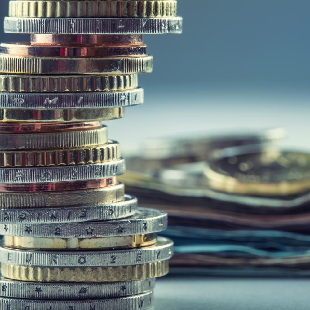 Euro,Coins,Stacked,On,Each,Other,In,Different,Positions.
