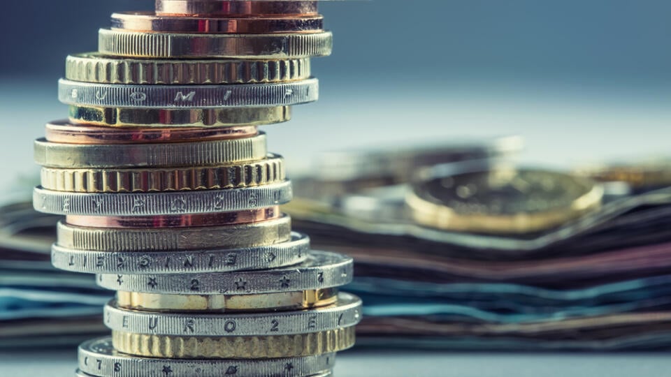 Euro,Coins,Stacked,On,Each,Other,In,Different,Positions.