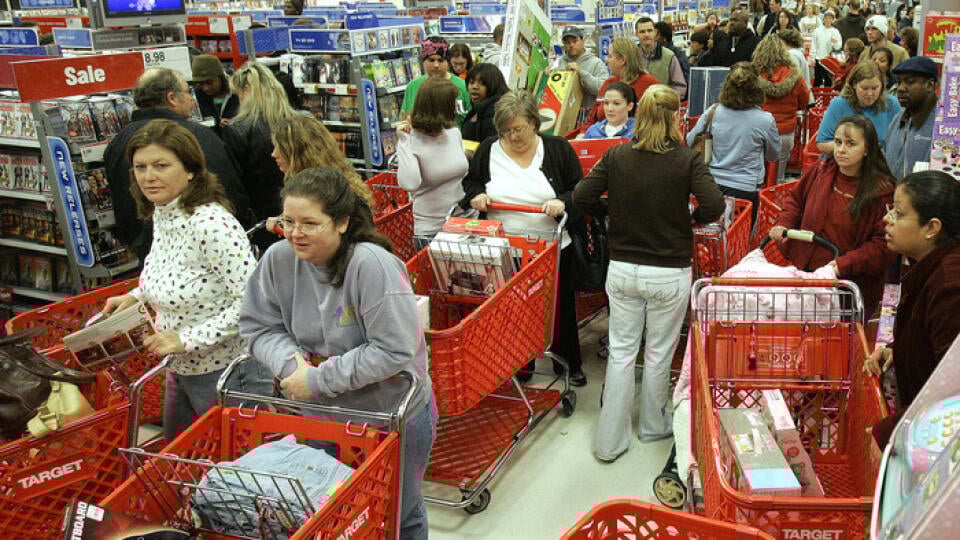 ** ADVANCE FOR FRIDAY, DEC. 22--FILE **The isle of a Tallahassee, Fla., Target store is a virtual gridlock of shopping carts as customers take advantage of early store hours looking for bargains and sales, in this Nov. 24, 2006, file photo. There's no doubt Americans are materialistic about Christmas. Almost half of all Americans crammed stores on the day after Thanksgiving this year, the traditional beginning of the holiday shopping season. By the time the Christmas shopping season is over, th