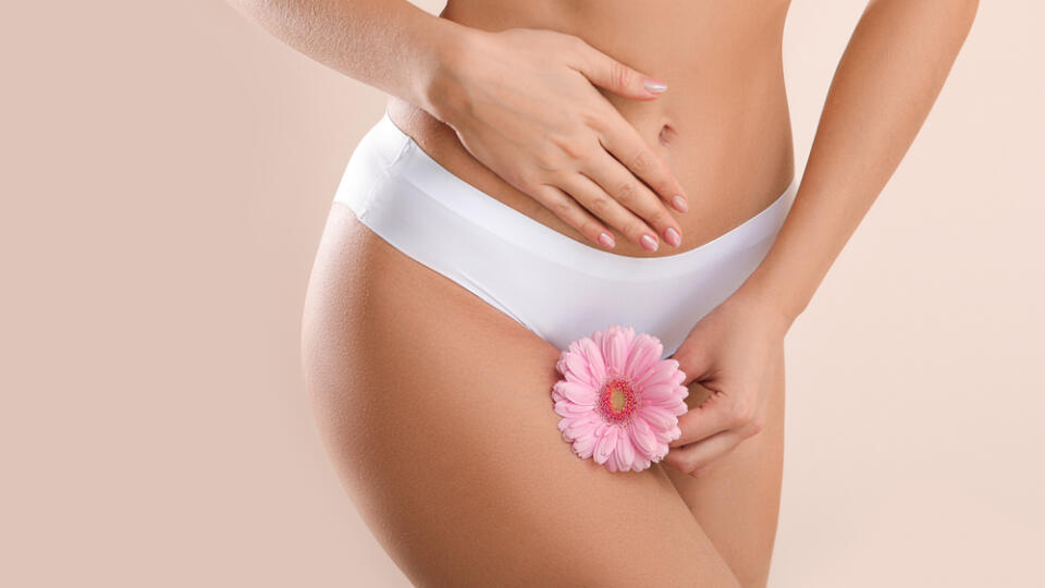 Young,Woman,With,Flower,On,Light,Background.,Gynecology,Concept