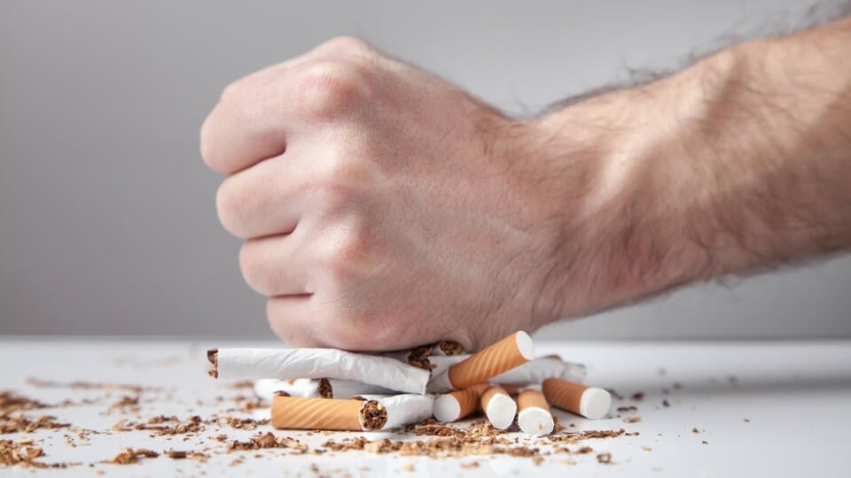 Male,Hand,Breaking,A,Cigarettes.,Quitting,Smoking