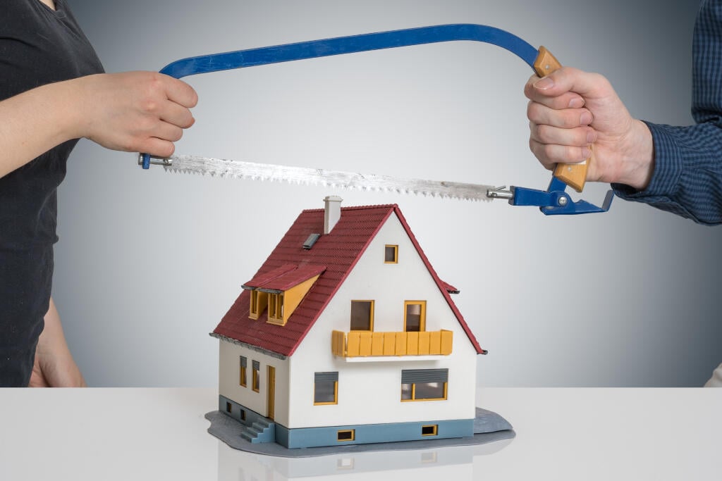 Divorce,And,Dividing,A,House,Concept.,Man,And,Woman,Are