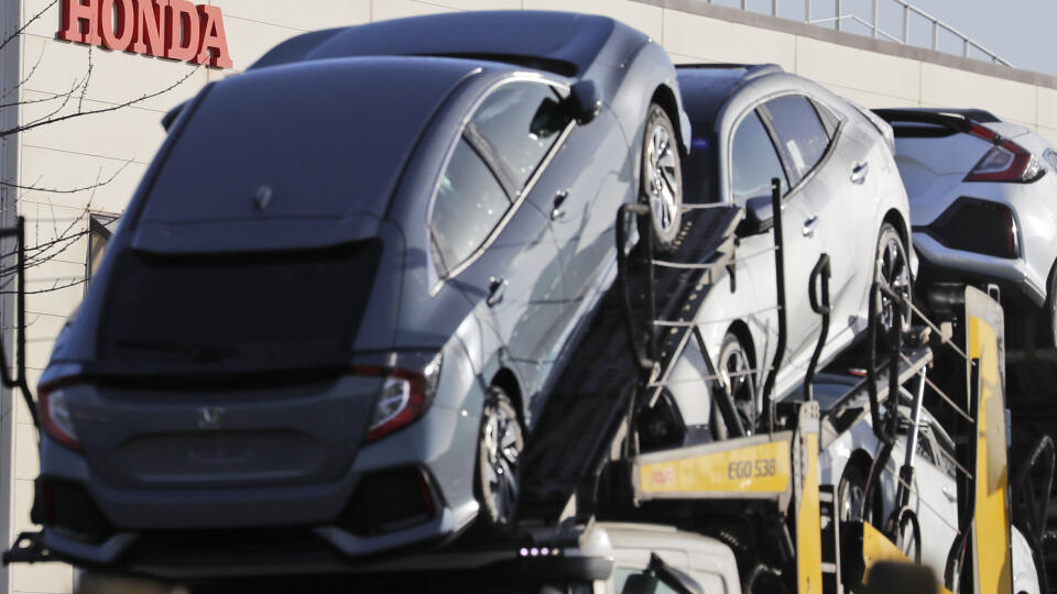 Honda cars leave the Honda plant in Swindon, England, Tuesday, Feb. 19, 2019. The Japanese carmaker Honda announced Tuesday that its Swindon car plant in western England, will close with the potential loss of some 3,500 jobs. (AP Photo/Frank Augstein)