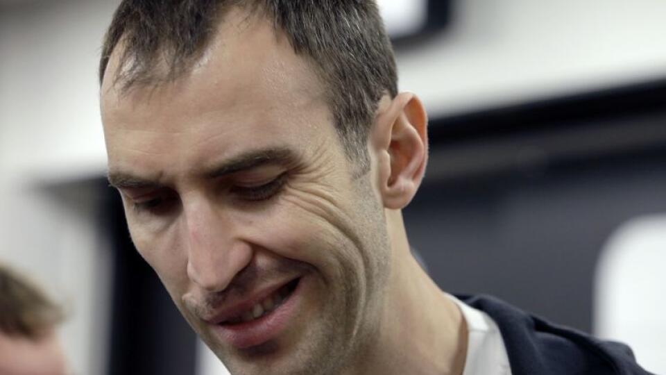 Boston Bruins captain Zdeno Chara, of Slovakia, grimaces as he speaks to media in the team's locker room at TD Garden Friday, May 16, 2014, in Boston. The Montreal Canadiens eliminated the Bruins with a 3-1 win in Game 7 of their second-round Stanley Cup playoff NHL hockey series on Wednesday. (AP Photo/Steven Senne)
