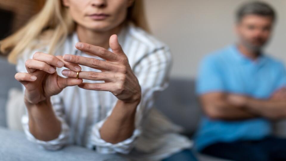 Unhappy,Middle,Aged,European,Lady,Takes,Off,Ring,,Ignoring,Man