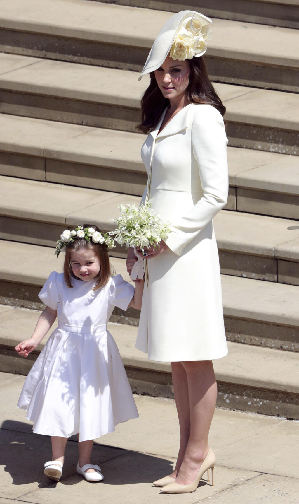 Kate Duchess of Cambridge and Princess Charlotte leave after the wedding ceremony of Prince Harry and Meghan Markle at St. George's Chapel in Windsor Castle in Windsor, near London, England, Saturday, May 19, 2018. (Andrew Matthews/pool photo via AP)