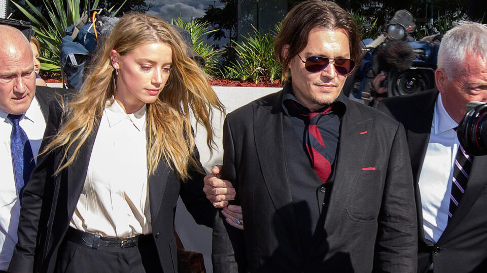 Amber Heard and Johnny Depp leave Southport Magistrates Court after signing a deal for dog smuggling charges laid against them.