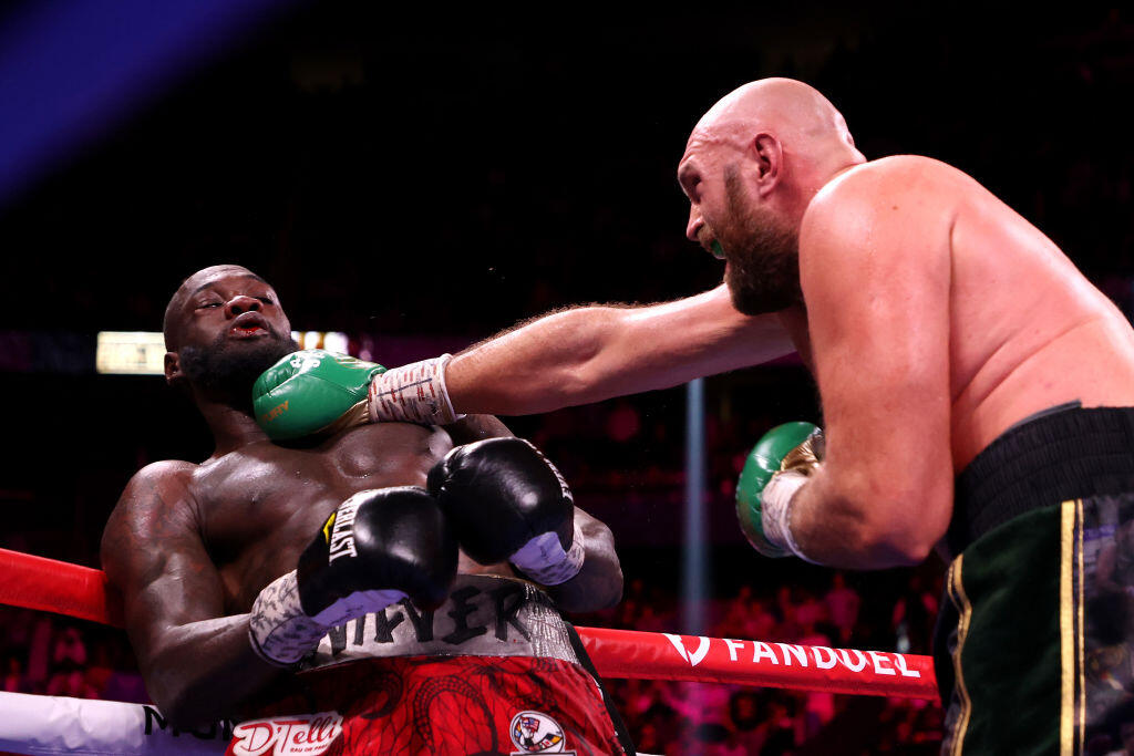 LAS VEGAS, NEVADA - OCTOBER 09: Tyson Fury (R) punches Deontay Wilder during their WBC heavyweight title fight at T-Mobile Arena on October 09, 2021 in Las Vegas, Nevada. (Photo by Al Bello/Getty Images)