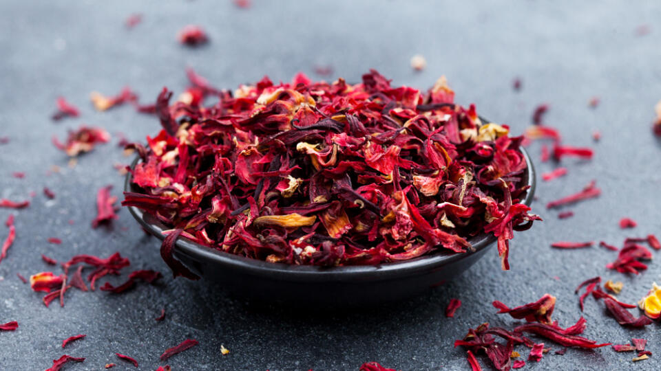 Hibiscus,Tea,In,Black,Bowl.,Slate,Background.,Copy,Space.