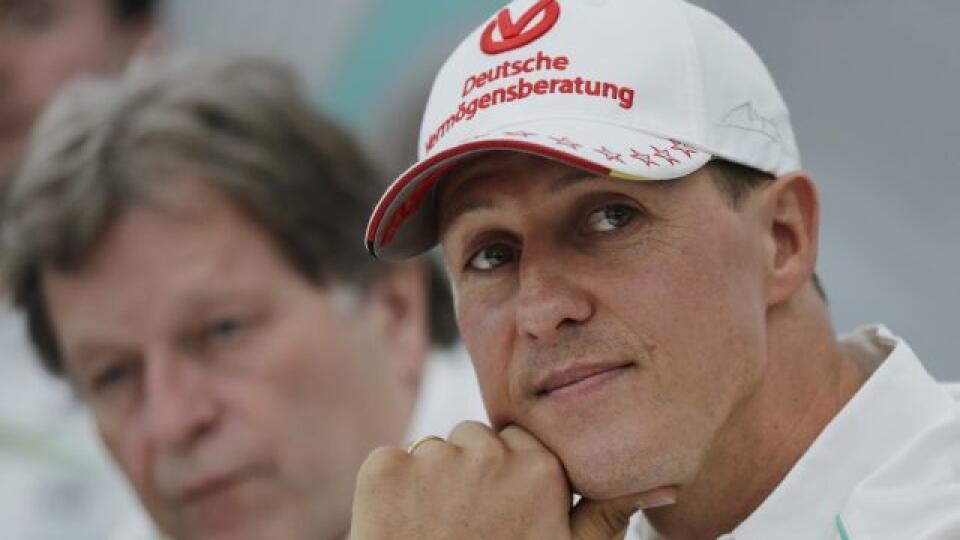 FILE - In this Thursday, Oct. 4, 2012 file photo, former Mercedes F1 driver Michael Schumacher of Germany pauses during a news conference to announce his retirement from Formula One at the end of  2012  in Suzuka, Japan.  Former Formula One world champion Michael Schumacher has left hospital to continue his recovery at home, his manager said Tuesday. The seven-time champion suffered a serious head injury while skiing in France in December, resulting in him being put in a coma. (AP Photo/Shizuo K