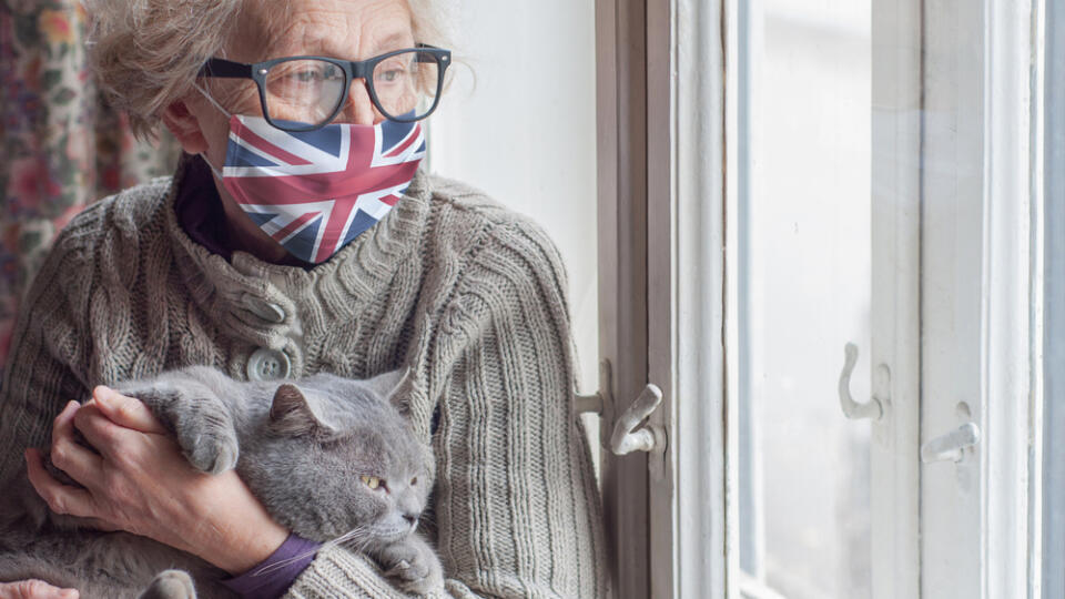 Older,Woman,In,A,Protective,Mask,With,A,British,Flag