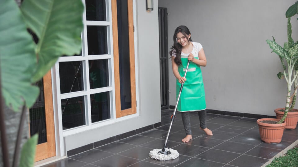 Happy,Housewife,Cleaning,The,Floor,With,Mop,In,The,Terrace