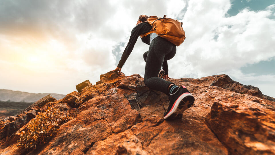 Success,Woman,Hiker,Hiking,On,Sunrise,Mountain,Peak,-,Young