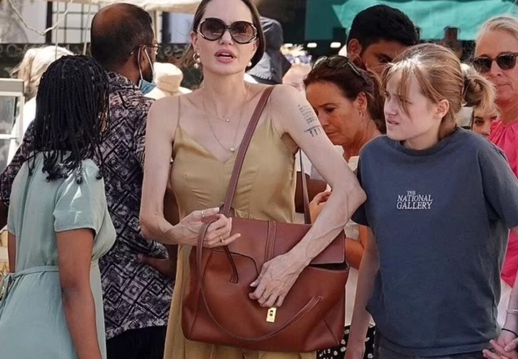 Actress Angelina Jolie often takes her children to restaurants, but judging by her hands, she could eat a little more.