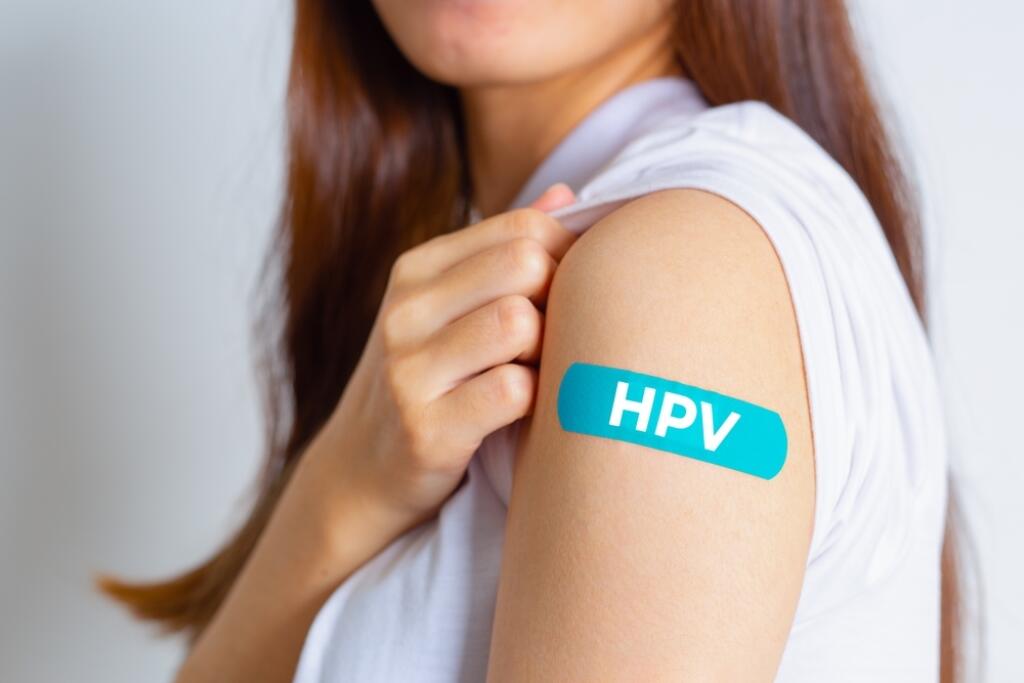 Hpv,(human,Papillomavirus),Teenager,Woman,Showing,Off,An,Blue,Bandage