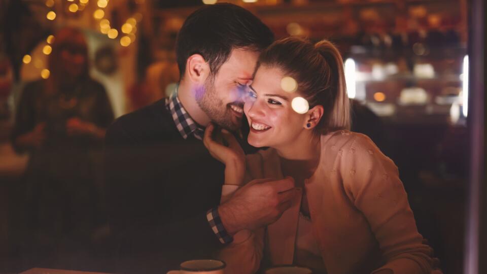 Couple dating at night in pub