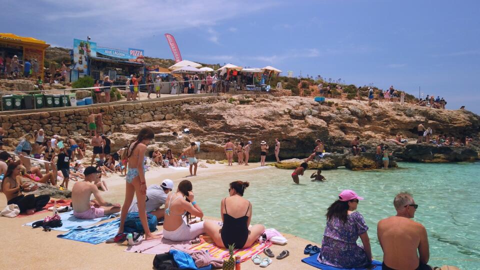 Comino, Malta 29.05.2024 - Blue lagoon. Tourists on the port vaiting for ferry to Malta and Gozo. High quality photo