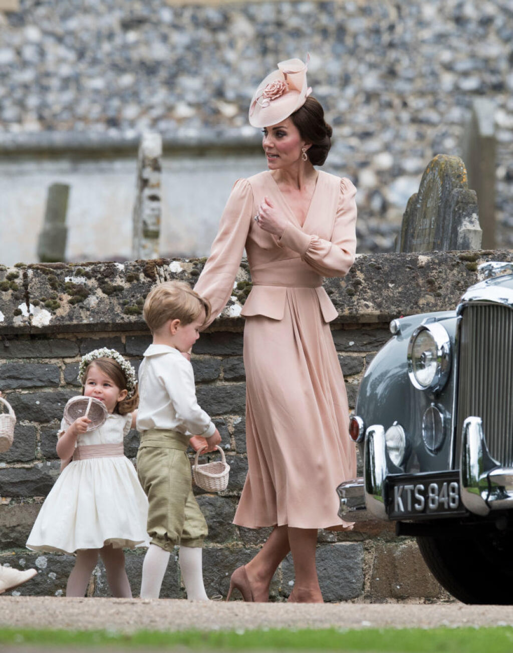 ENGLEFIELD GREEN, ENGLAND - MAY 20: Catherine, Duchess of Cambridge speaks to Princess Charlotte after the wedding of Pippa Middleton and James Matthews at St Mark's Church on May 20, 2017 in in Englefield, England. (Photo by Arthur Edwards - WPA Pool/Getty Images)