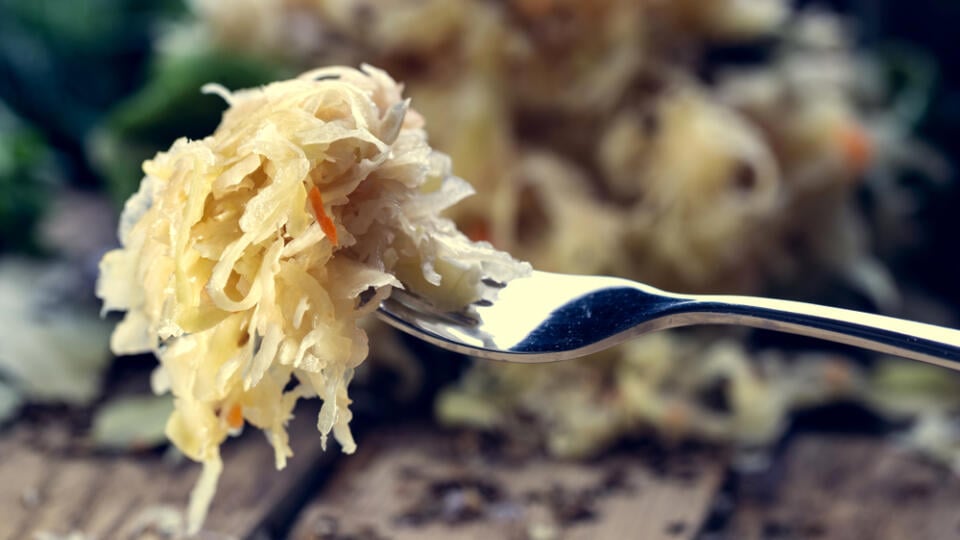 Sauerkraut,On,A,Fork,With,A,Shallow,Depth,Of,Field.