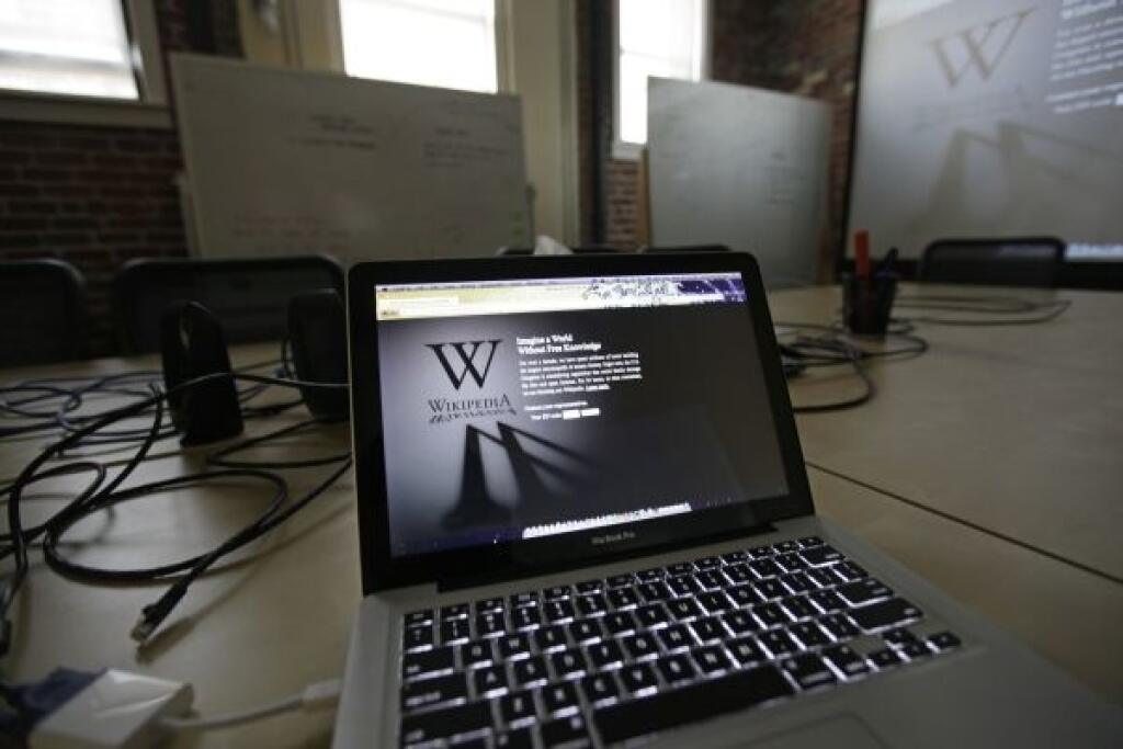 A blackout landing page is displayed on a laptop computer screen inside the 