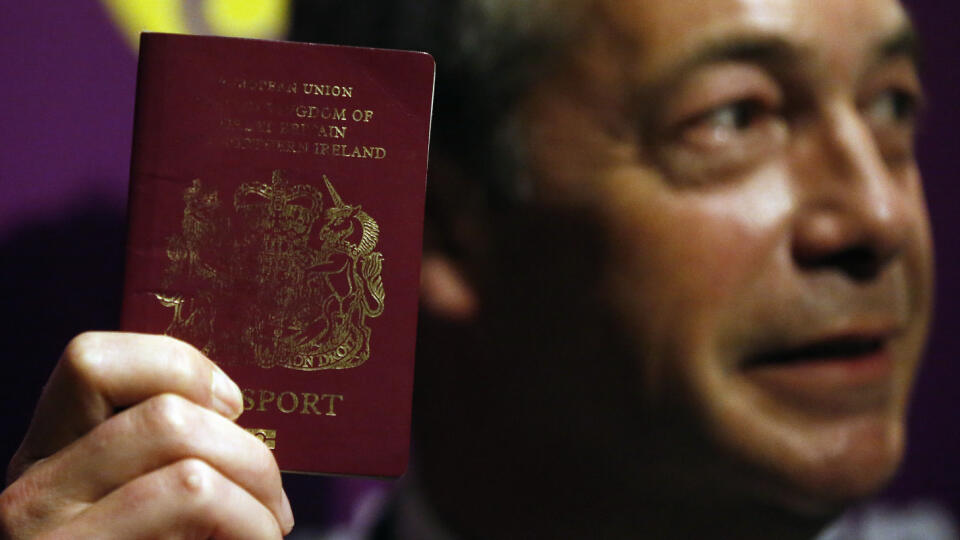UK Independence Party (UKIP) party leader Nigel Farage shows his passport as he addresses media and party members during a speech focusing on the upcoming EU referendum in London, Friday, June 3, 2016. Farage is a leading campaigner advocating Britain to cut its ties with the rest of Europe, known by the name, 'Brexit'.(AP Photo/Frank Augstein)