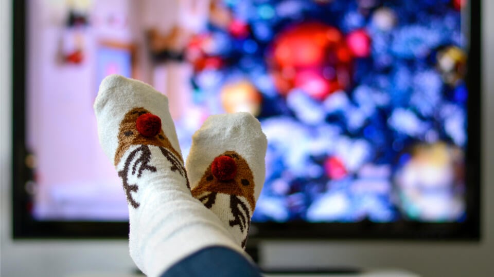 Cozy,Warm,Winter,Christmas,Socks,With,A,Reindeer.,Person,Watching