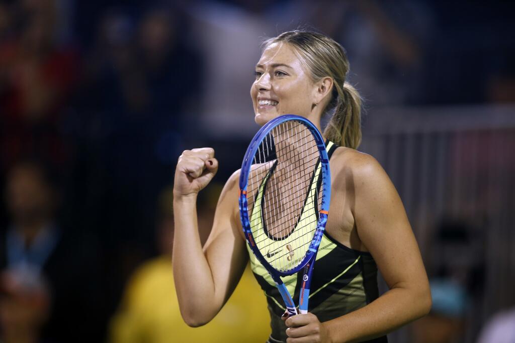 Maria Sharapova reacts after a point during a World Team Tennis exhibition to benefit the Elton John AIDS Foundation on Monday, Oct. 10, 2016, in Las Vegas. (AP Photo/Isaac Brekken)