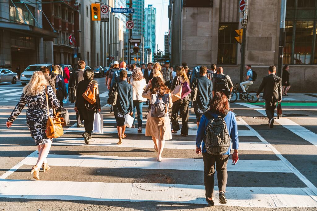 Crowd,Of,Unrecognisable,People,Crossing,Street,On,Traffic,Light,Zebra