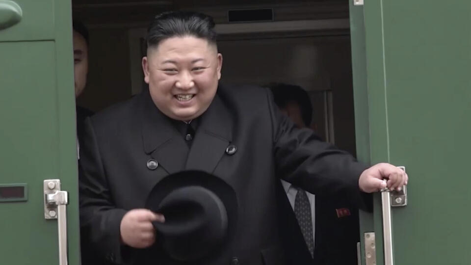 In this image from video released by Primorsky Regional Administration Press Service, North Korean leader Kim Jong Un smiles as he leaves Khasan train station in Primorye region, Russia, Wednesday, April 24, 2019. Kim arrived in Russia by train on Wednesday, a day before his much-anticipated summit with Russian President Vladimir Putin that comes amid deadlocked diplomacy on his nuclear program. (Primorsky Regional Administration Press Service via AP)