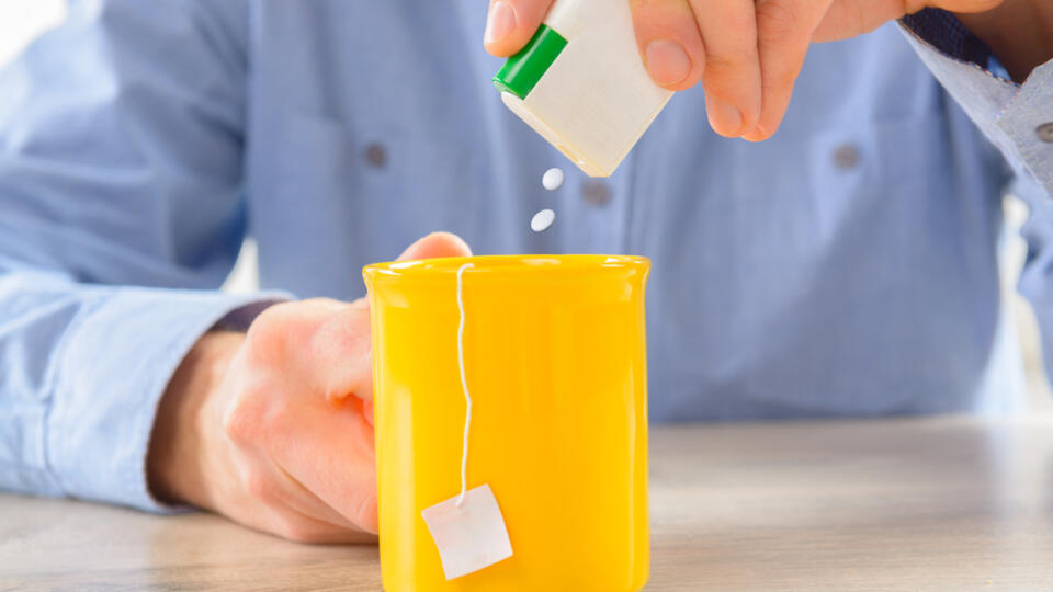 Sweetener,Tablets,And,Hand,With,Box,Whit,Cup,Of,Tea