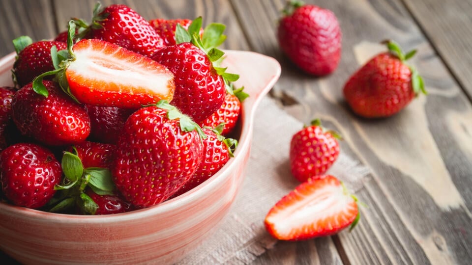 Fresh,Strawberries,In,A,Bowl,On,Wooden,Table,With,Low