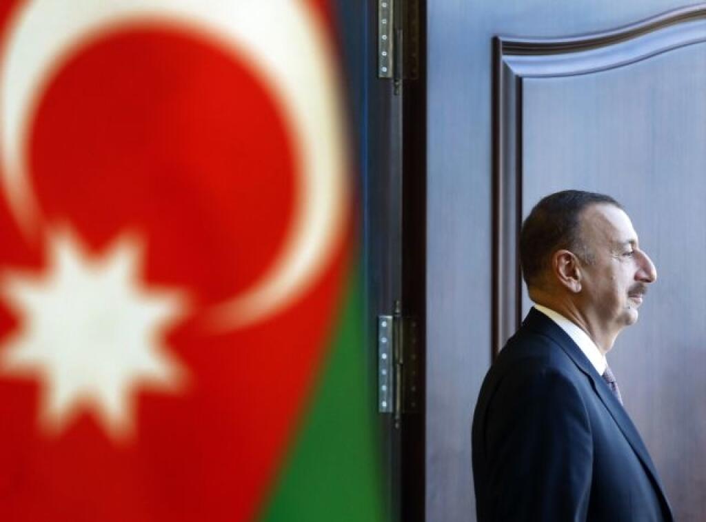 WA 8 Baku - Azerbajdžanský prezident Ilham Alijev odchádza z volebnej miestnosti po odovzdaní svojho hlasu počas prezidentských volieb v Baku 9. októbra 2013. FOTO TASR / AP Azerbaijan President Ilham Aliyev leaves a polling station in Baku, Azerbaijan, Wednesday, Oct. 9, 2013. Oil-rich Azerbaijan is booming and the wealth is trickling down to its poorest people. It all means that its president doesn't even need to clamp down too hard to ensure he extends a decades-long dynastic rule in election