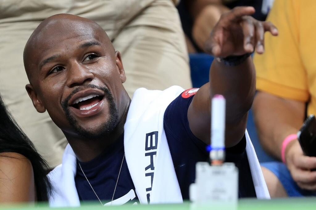 RIO DE JANEIRO, BRAZIL - AUGUST 17: Boxer Floyd Mayweather Jr. sits courtside as the United States takes on Argentina during the Men's Quarterfinal match on Day 12 of the Rio 2016 Olympic Games at Carioca Arena 1 on August 17, 2016 in Rio de Janeiro, Brazil. (Photo by Sam Greenwood/Getty Images)