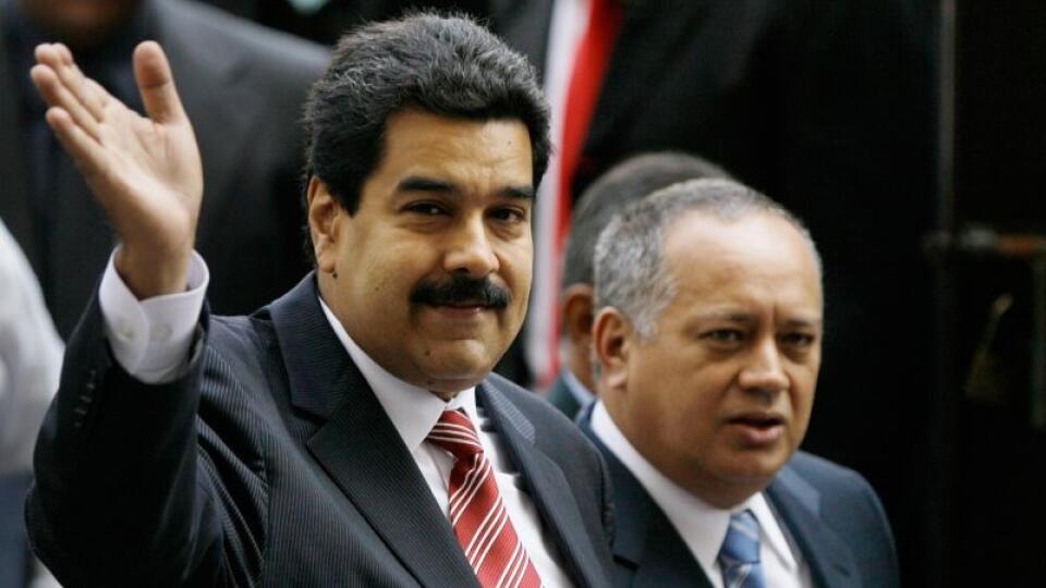 Venezuela's Vice President Nicolas Maduro, left, and National Assembly President Diosdado Cabello greet the media as they arrive to the Supreme Court for a special session marking the start of the judicial year in Caracas, Venezuela, Monday, Jan. 21, 2013. Maduro said Sunday he's optimistic that President Hugo Chavez will soon return to Venezuela following cancer-related surgery in Cuba. (AP Photo/Fernando Llano)