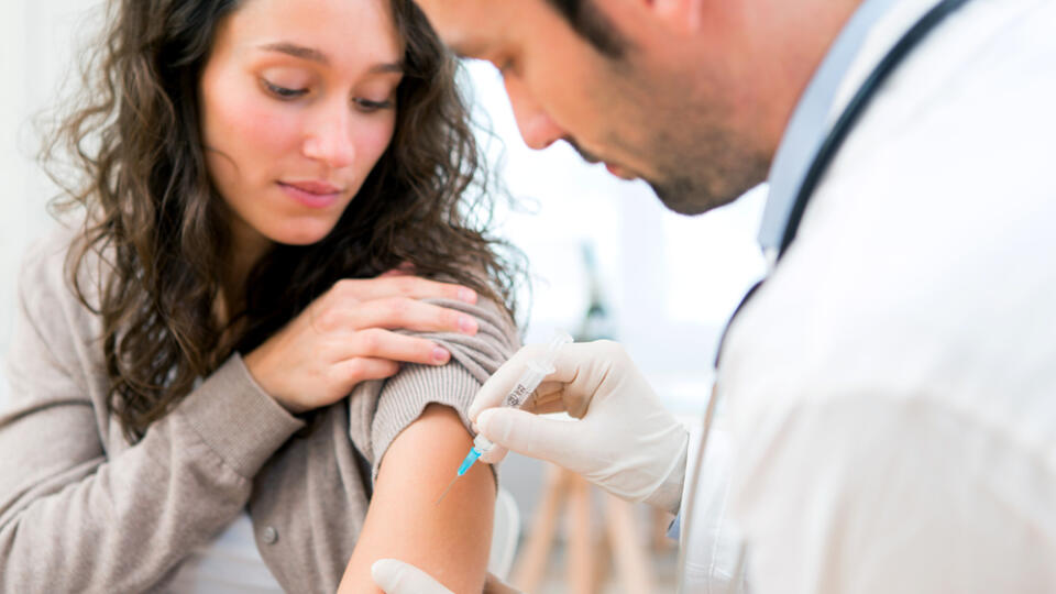 View,Of,A,Young,Attractive,Woman,Being,Vaccinated